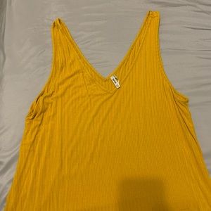 A XXL yellow t-shirt that is made by Mudd.